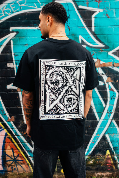 An Scéalaí white on black t-shirt back design